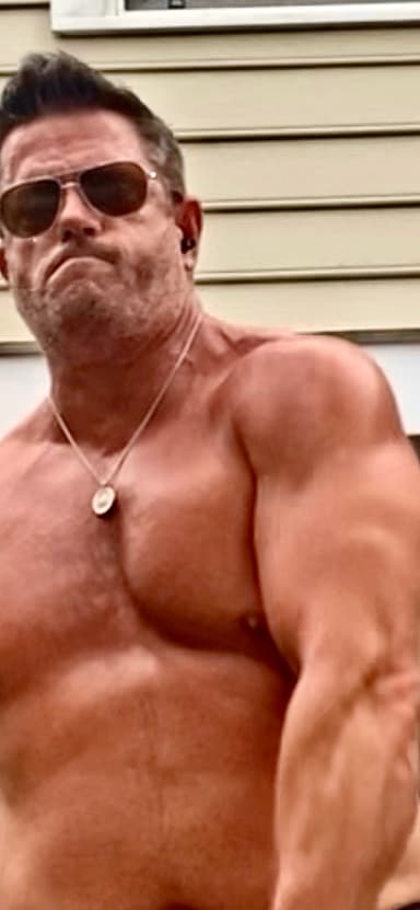 Rob Scott performing kettlebell training, demonstrating physical transformation and strength